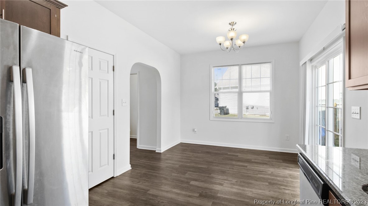 217 Fieldbrook Street Raeford, NC 28376 - Photo 15 of 42 a view of a livingroom with a ceiling fan window and hardwood floor