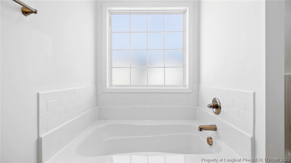 217 Fieldbrook Street Raeford, NC 28376 - Photo 19 of 42 a close up of a bathtub curtain