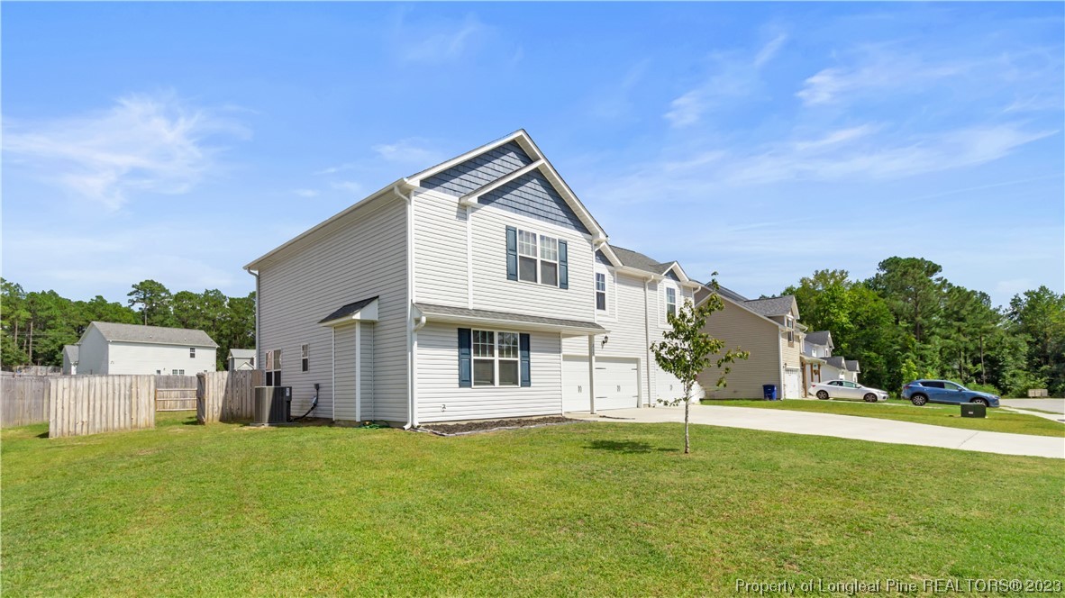 217 Fieldbrook Street Raeford, NC 28376 - Photo 2 of 42 a front view of a house with a garden