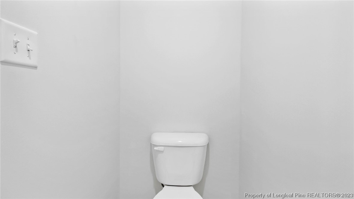 217 Fieldbrook Street Raeford, NC 28376 - Photo 21 of 42 a white toilet sitting in a bathroom