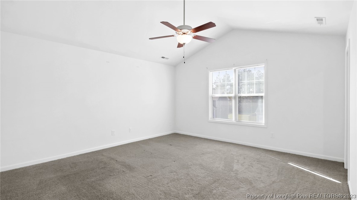 217 Fieldbrook Street Raeford, NC 28376 - Photo 22 of 42 an empty room with a window and a ceiling fan
