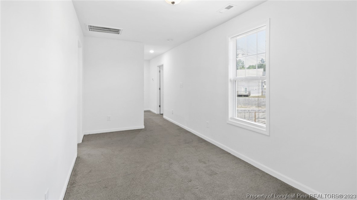 217 Fieldbrook Street Raeford, NC 28376 - Photo 28 of 42 a view of an empty room with a window