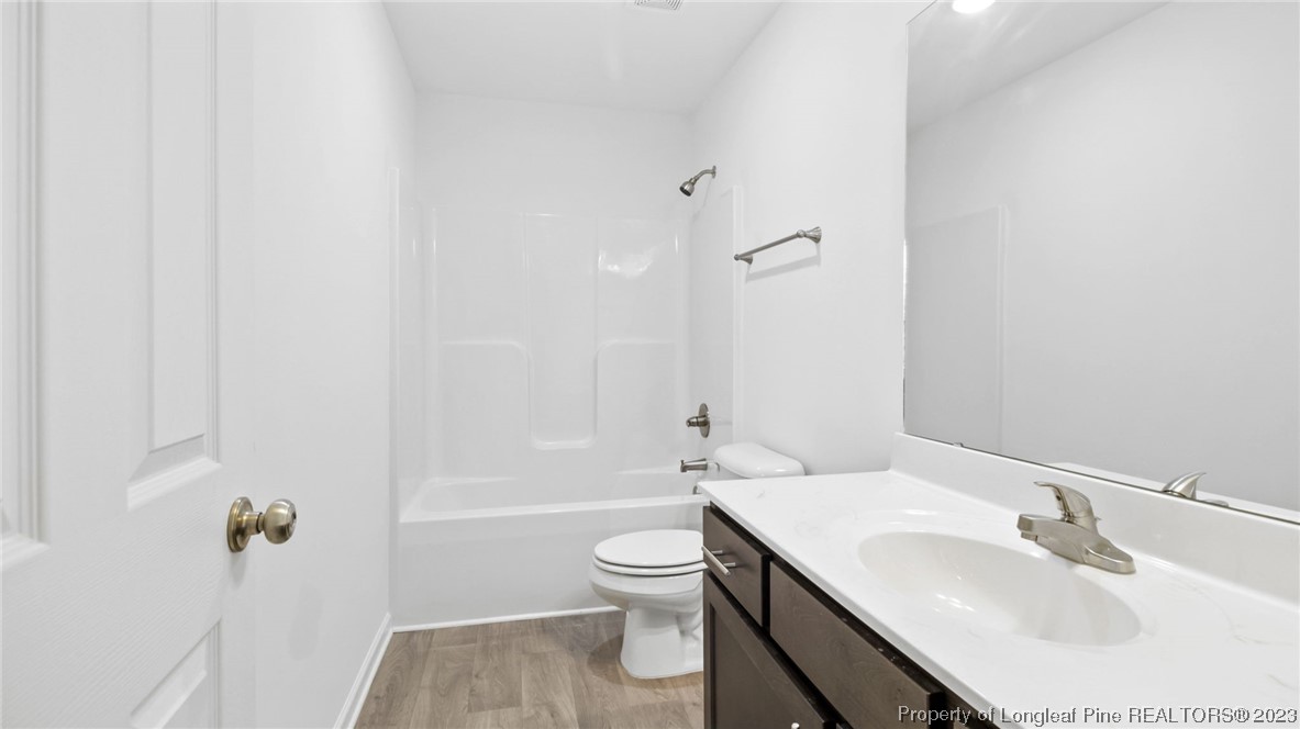 217 Fieldbrook Street Raeford, NC 28376 - Photo 29 of 42 a bathroom with a sink toilet and shower