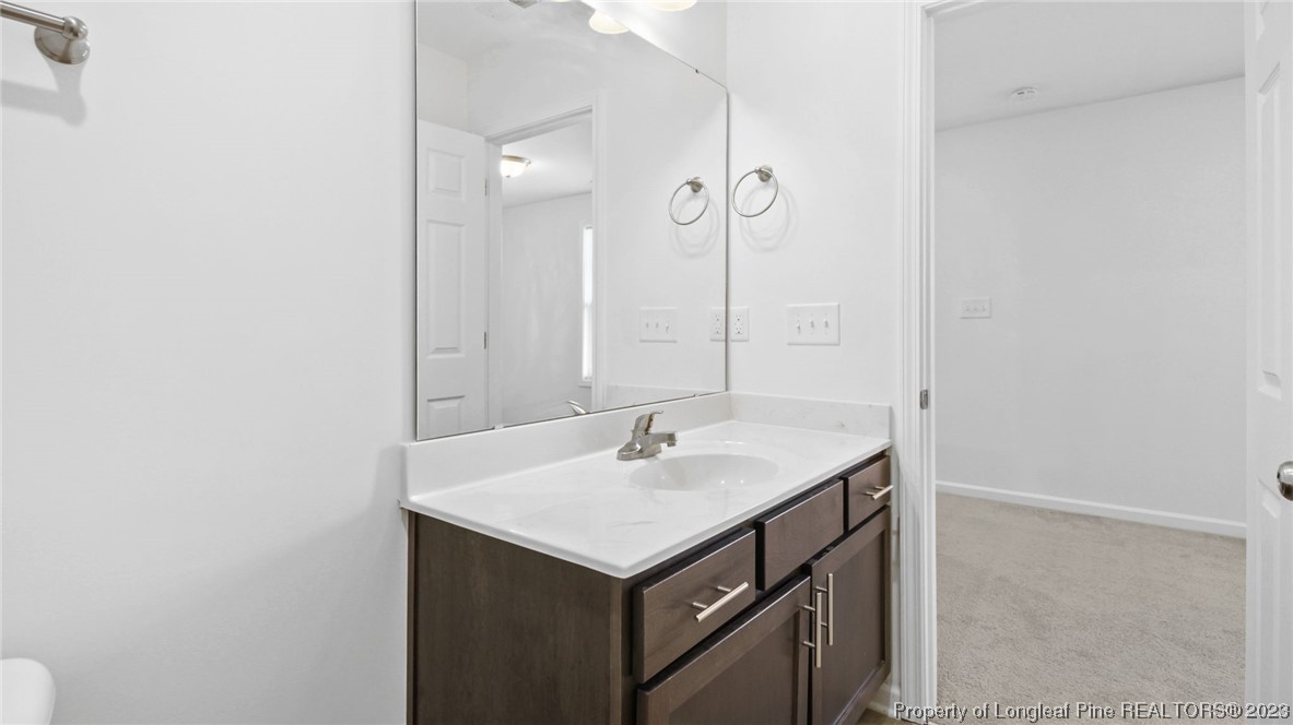 217 Fieldbrook Street Raeford, NC 28376 - Photo 30 of 42 a bathroom with a sink and a mirror