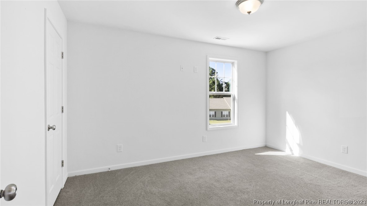 217 Fieldbrook Street Raeford, NC 28376 - Photo 31 of 42 an empty room with windows