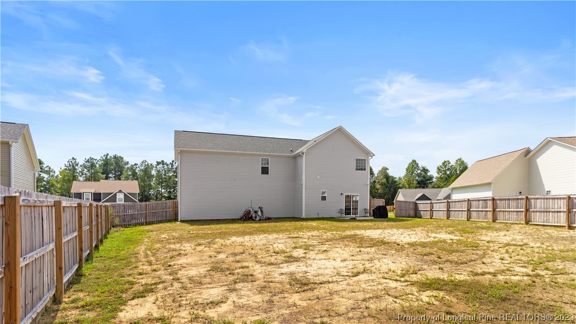 217 Fieldbrook Street Raeford, NC 28376 - Photo 39 of 42 a house view with swimming pool and wooden fence