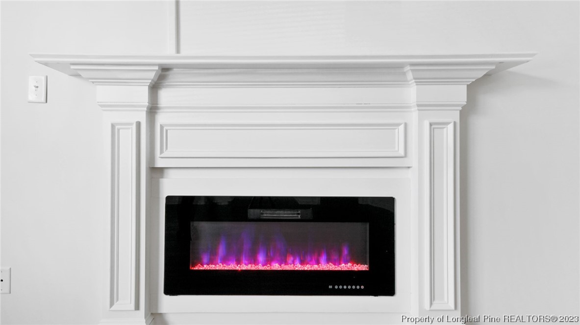 217 Fieldbrook Street Raeford, NC 28376 - Photo 5 of 42 a living room with a fireplace