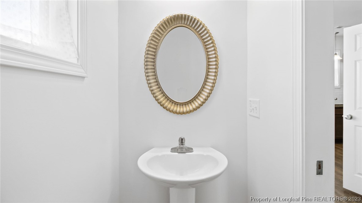 217 Fieldbrook Street Raeford, NC 28376 - Photo 8 of 42 a bathroom with a sink and a mirror