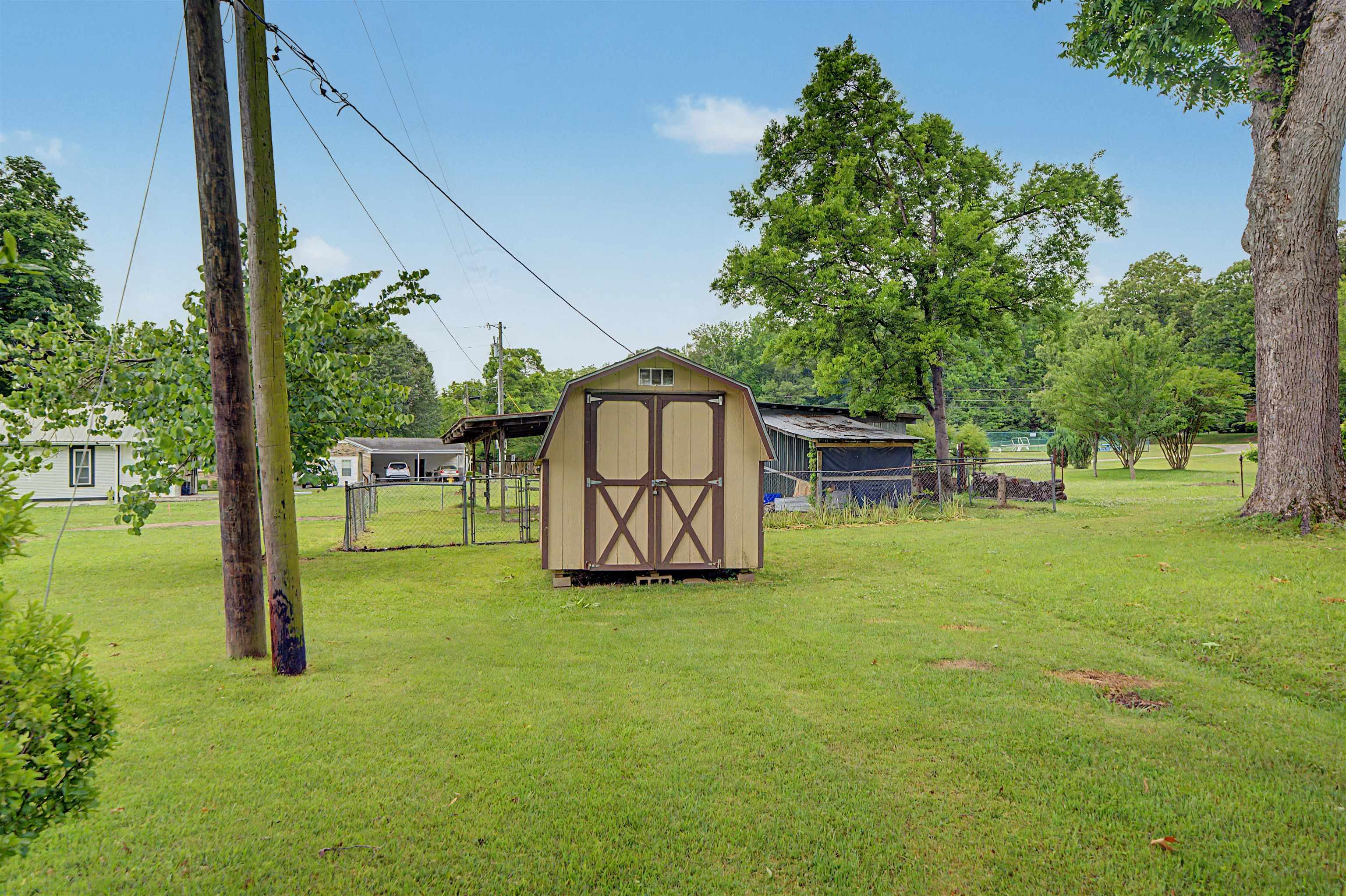 12 Baker Road Selmer, TN 38375 - Photo 11 of 28 a view of a backyard with a garden and entertaining space