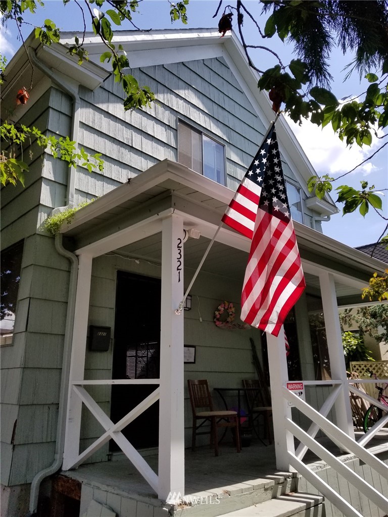 2321 Rucker Avenue Everett, WA 98201 - Photo 1 of 12 a front view of a house with plants and a table