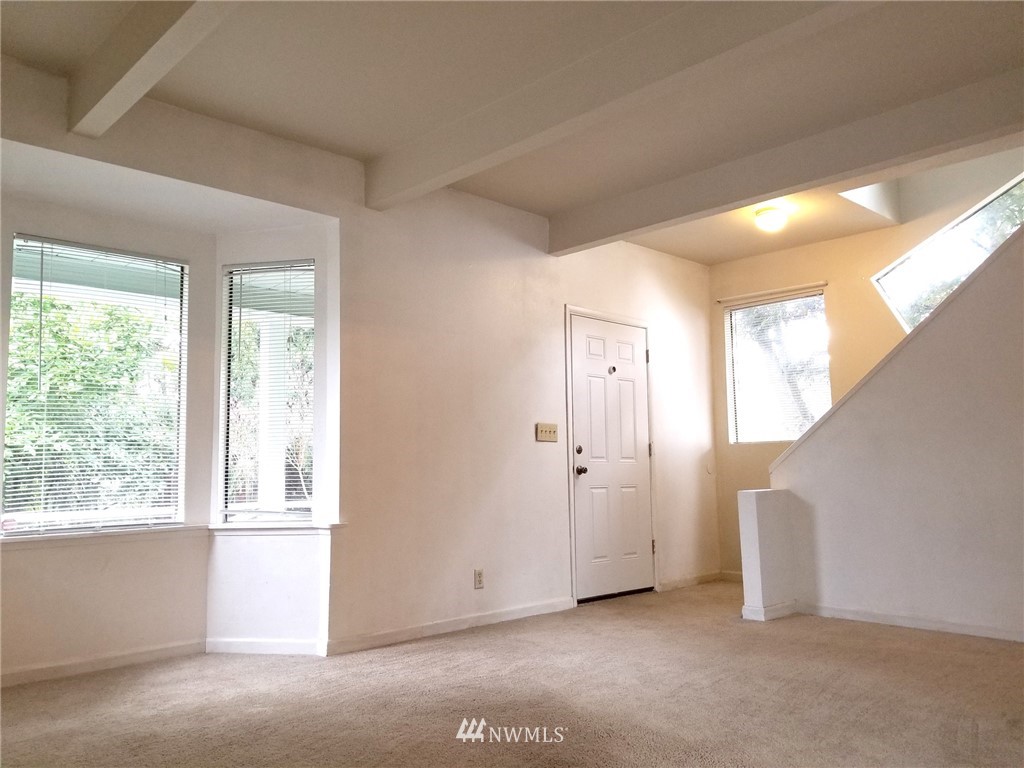 2321 Rucker Avenue Everett, WA 98201 - Photo 2 of 12 a view of an empty room with a window