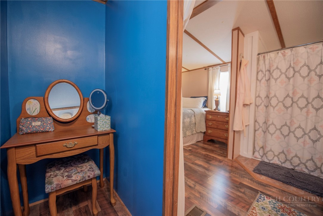 1848 West Mill Creek Road Warrensville, NC 28693 - Photo 30 of 50 a hallway with a stove a mirror and entryway