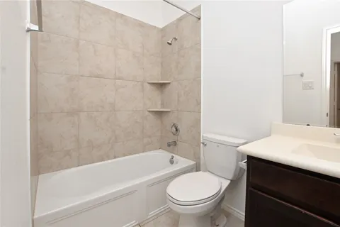 a bathroom with a sink toilet and bathtub