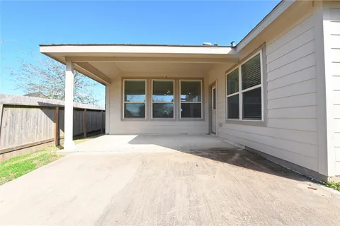 a view of house with door and wooden walls