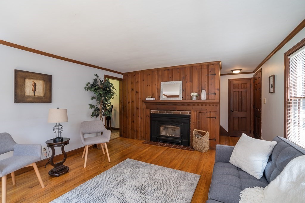152 Feeding Hills Road Southwick, MA 01077 - Photo 11 of 35 a living room with furniture and a fireplace