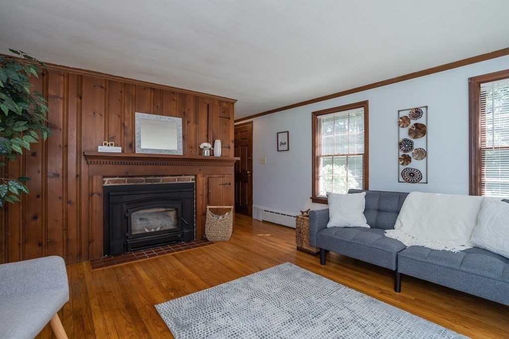 152 Feeding Hills Road Southwick, MA 01077 - Photo 12 of 35 a living room with furniture and a fireplace