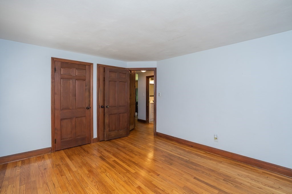 152 Feeding Hills Road Southwick, MA 01077 - Photo 14 of 35 a view of an empty room and wooden floor