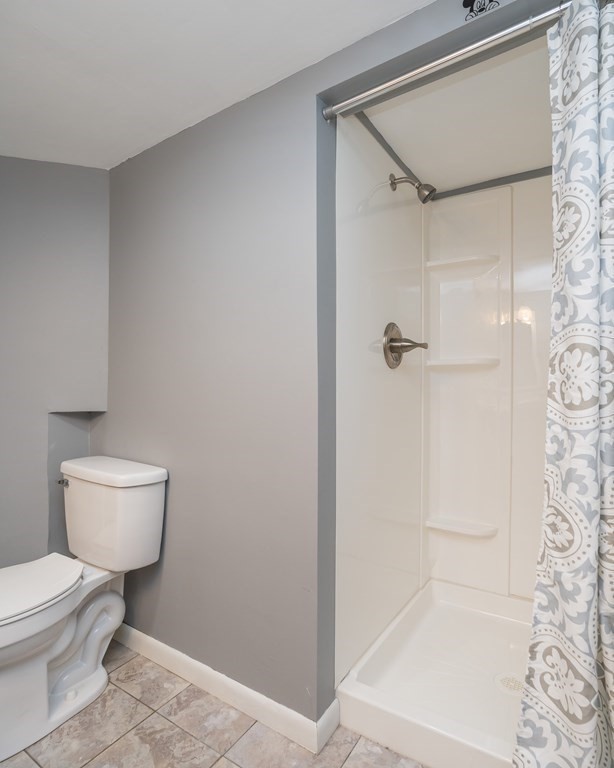 152 Feeding Hills Road Southwick, MA 01077 - Photo 19 of 35 a bathroom with a toilet and a shower