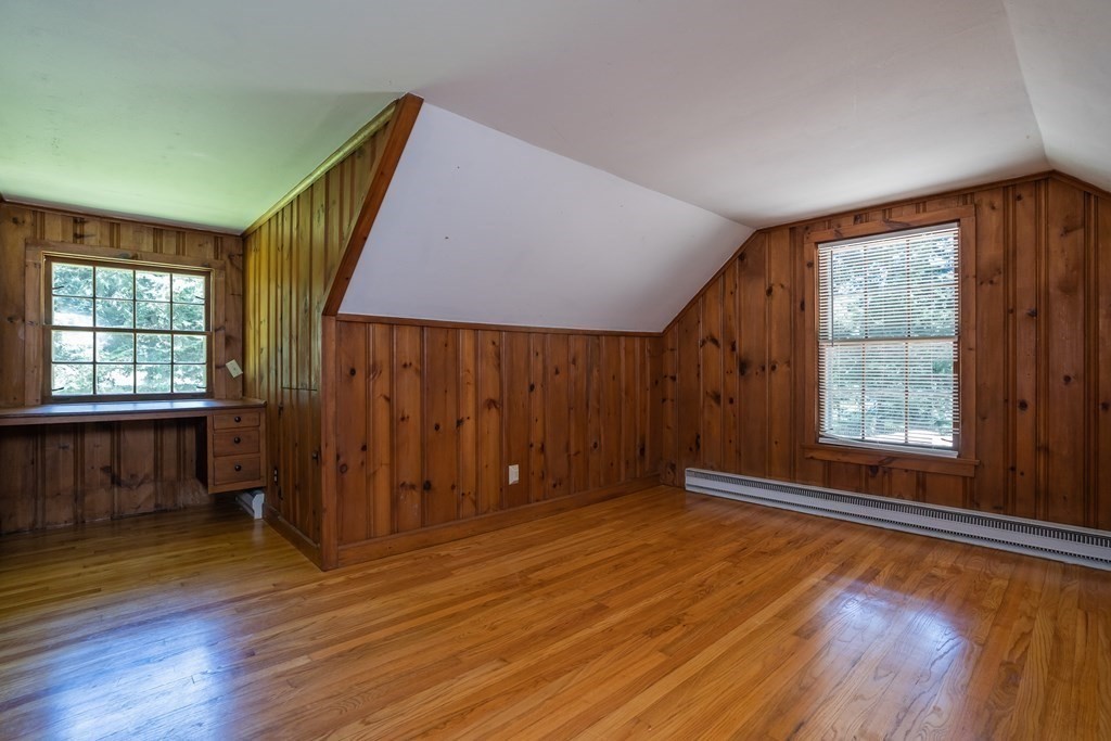 152 Feeding Hills Road Southwick, MA 01077 - Photo 23 of 35 a view of an empty room with wooden floor and a window