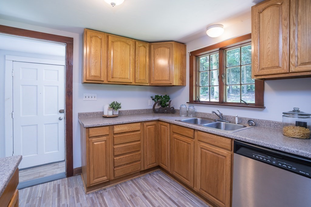 152 Feeding Hills Road Southwick, MA 01077 - Photo 3 of 35 a kitchen with sink cabinets and wooden floor