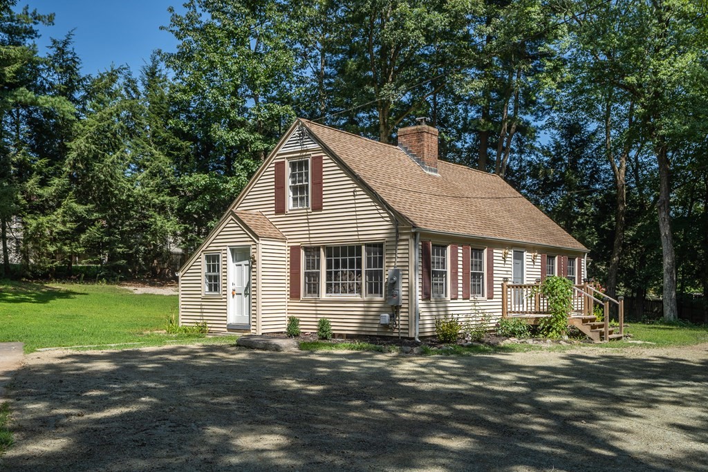 152 Feeding Hills Road Southwick, MA 01077 - Photo 34 of 35 a front view of a house with a garden