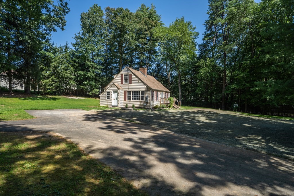 152 Feeding Hills Road Southwick, MA 01077 - Photo 35 of 35 a front view of a house with a yard and garage