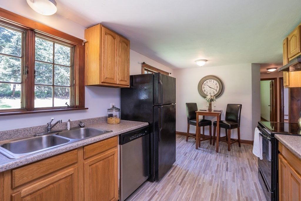 152 Feeding Hills Road Southwick, MA 01077 - Photo 5 of 35 a kitchen that has a sink cabinets counter space and a window
