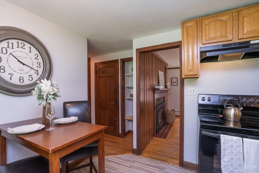 152 Feeding Hills Road Southwick, MA 01077 - Photo 8 of 35 a kitchen with stainless steel appliances granite countertop a refrigerator and a stove top oven
