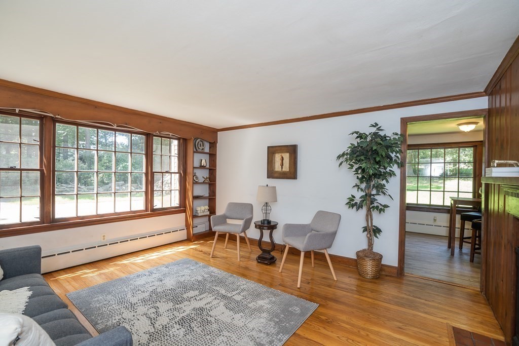 152 Feeding Hills Road Southwick, MA 01077 - Photo 9 of 35 a living room with furniture and a table with wooden floor
