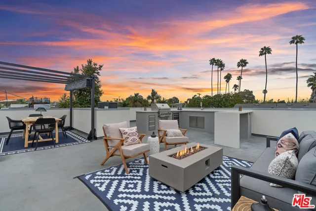 a terrace of a house with outdoor seating