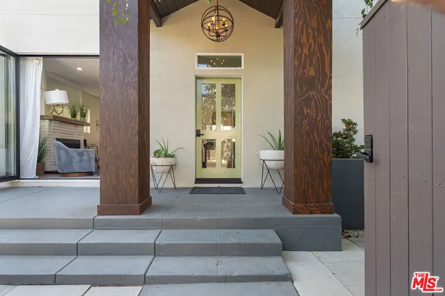a outdoor living space with furniture and a potted plant