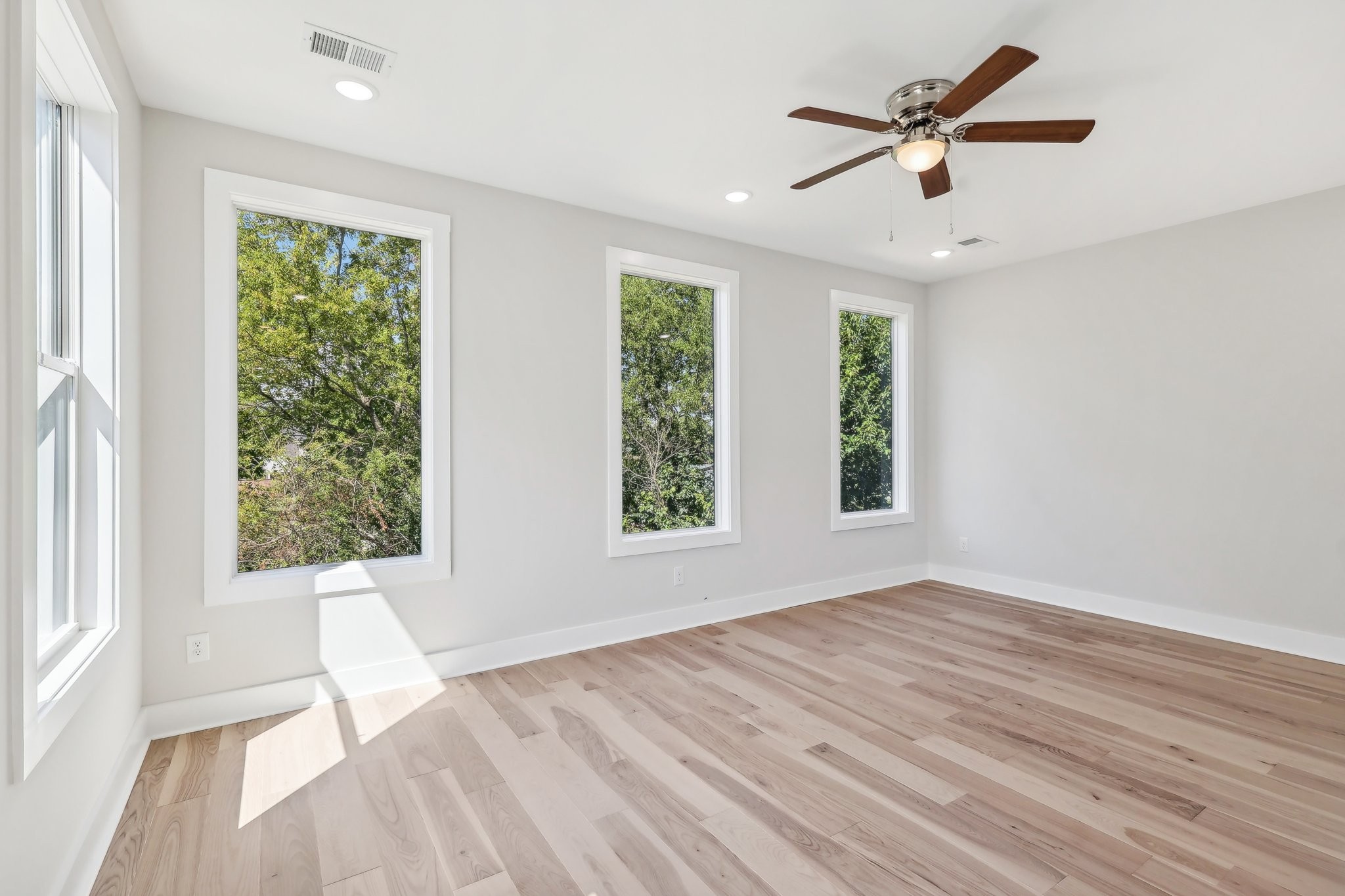 1041 Mitchell Road Nashville, TN 37206 - Photo 41 of 47 a view of an empty room with wooden floor and a window