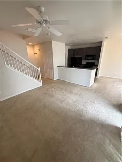 a view of a livingroom with a ceiling fan