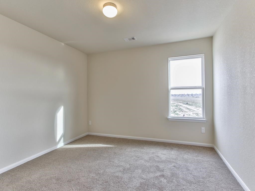 4615 Russet Leaf Trace Katy, TX 77449 - Photo 17 of 32 a view of empty room with window