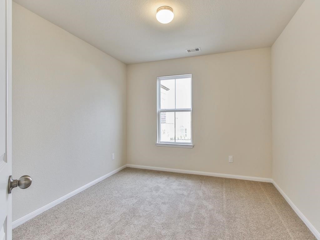 4615 Russet Leaf Trace Katy, TX 77449 - Photo 20 of 32 an empty room with a window