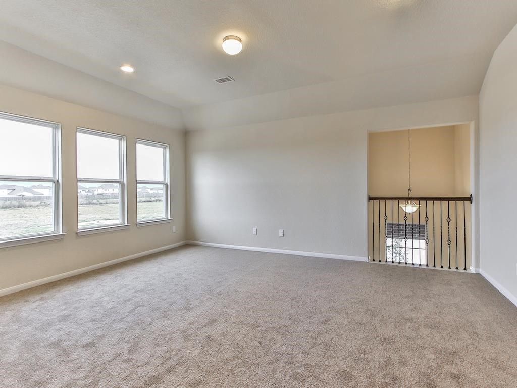 4615 Russet Leaf Trace Katy, TX 77449 - Photo 23 of 32 an empty room with windows