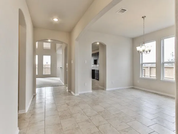 a view of an empty room with glass door