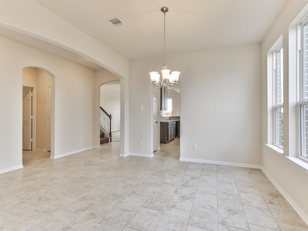 4615 Russet Leaf Trace Katy, TX 77449 - Photo 28 of 32 a view of a big room with windows and chandelier