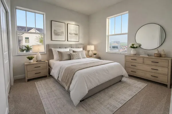 a bedroom with a bed and a dresser