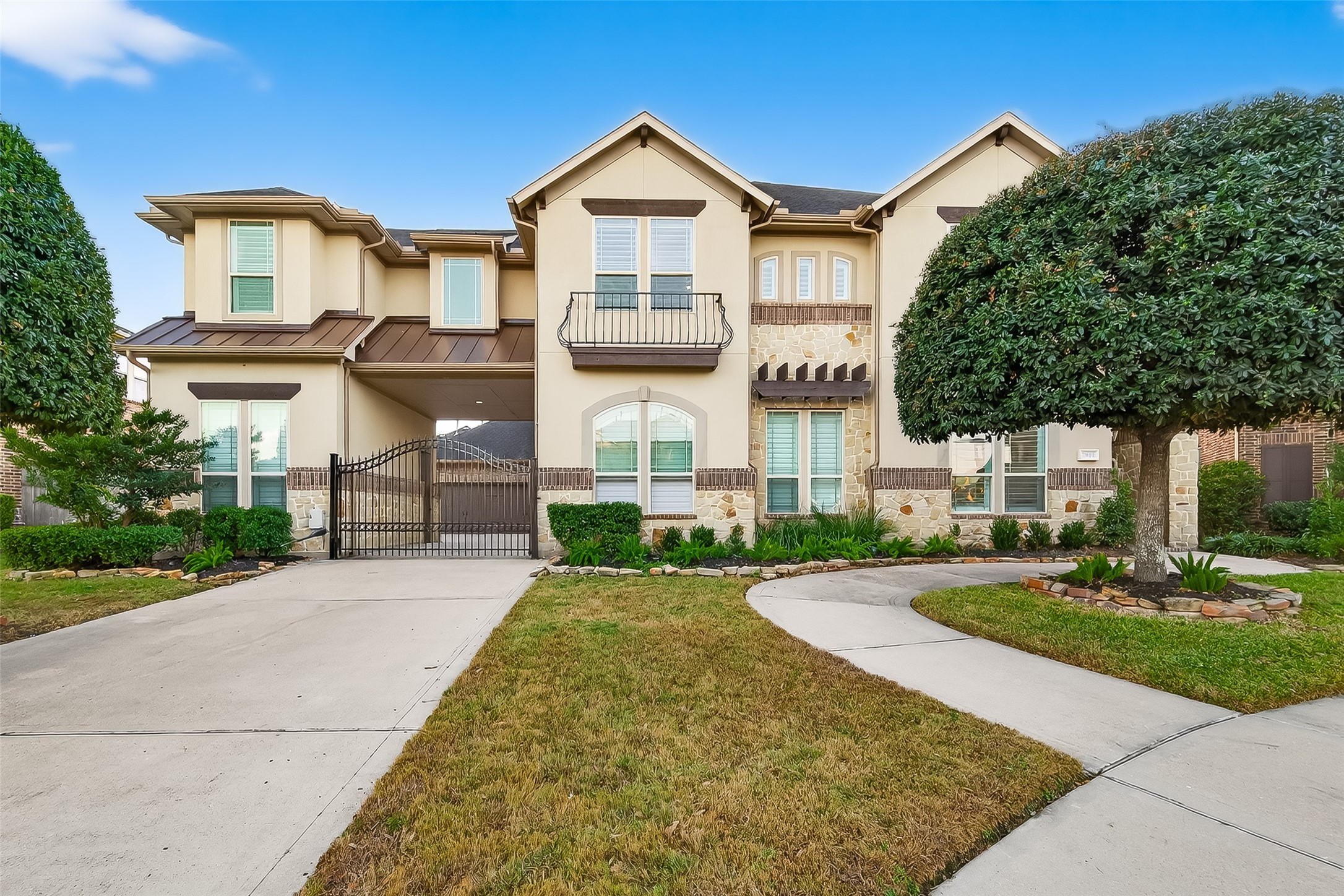 5815 Mustang Ridge Lane Fulshear, TX 77441 - Photo 1 of 50 a front view of a house with a yard and garage