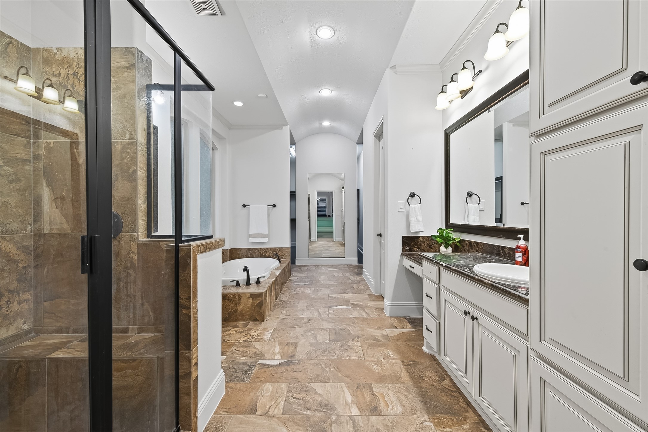 5815 Mustang Ridge Lane Fulshear, TX 77441 - Photo 22 of 50 a large white kitchen with stainless steel appliances a refrigerator and a stove