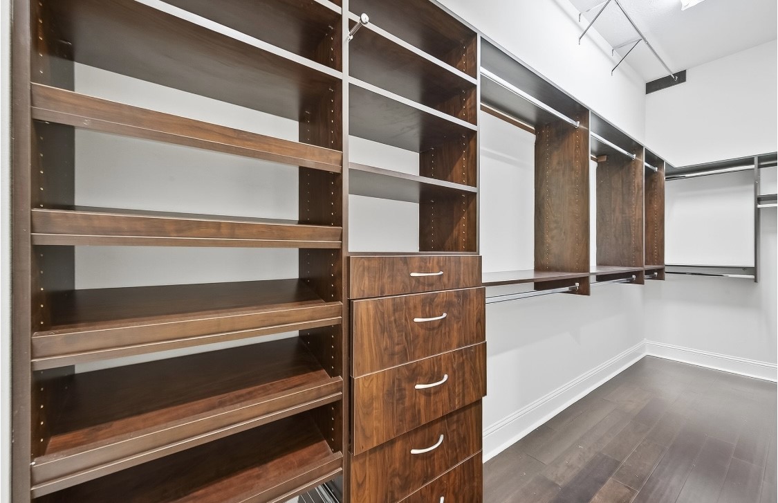 5815 Mustang Ridge Lane Fulshear, TX 77441 - Photo 27 of 50 a view of walk in closet with empty racks