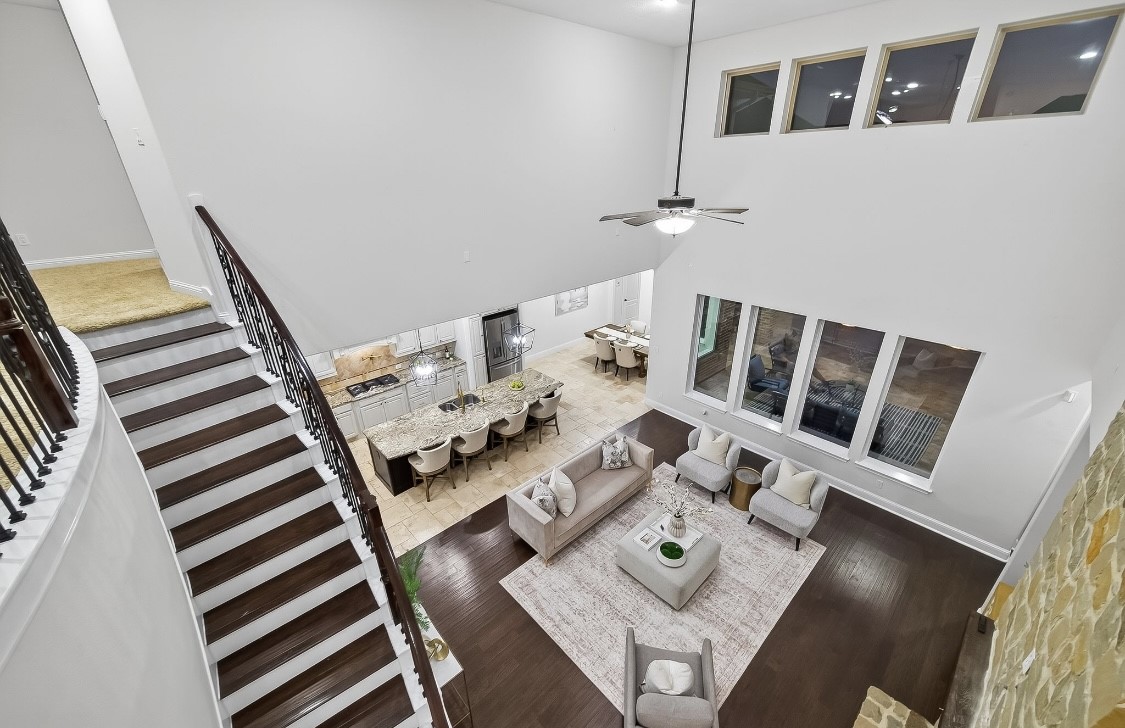 5815 Mustang Ridge Lane Fulshear, TX 77441 - Photo 28 of 50 a view of a dining room with furniture and wooden floor