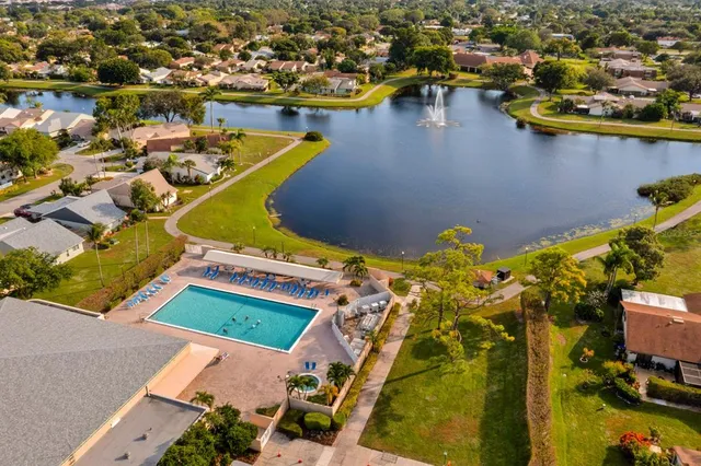an aerial view of a house with a lake view