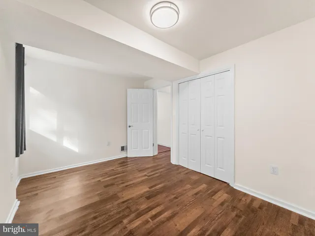 a view of staircase with white walls and a window