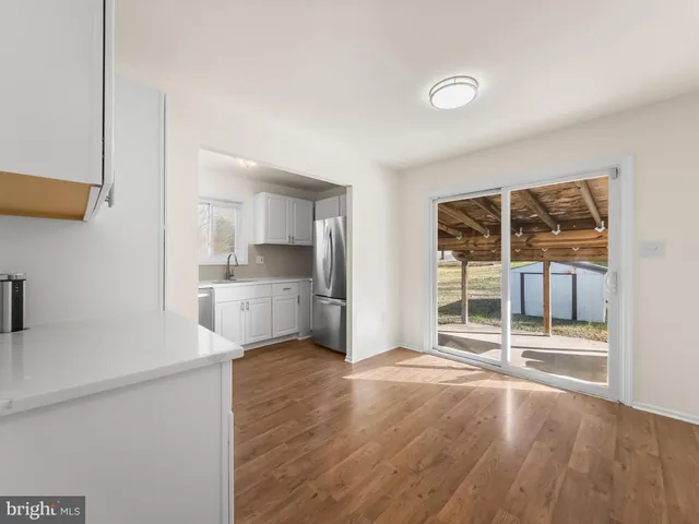a view of a kitchen with a sink and a stove top oven