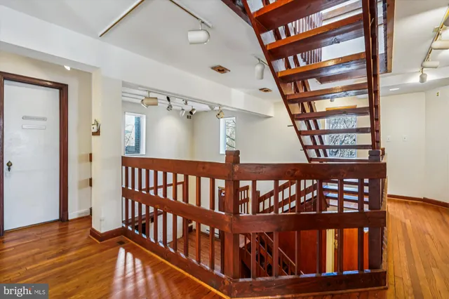 a view of an entryway with wooden floor and a window