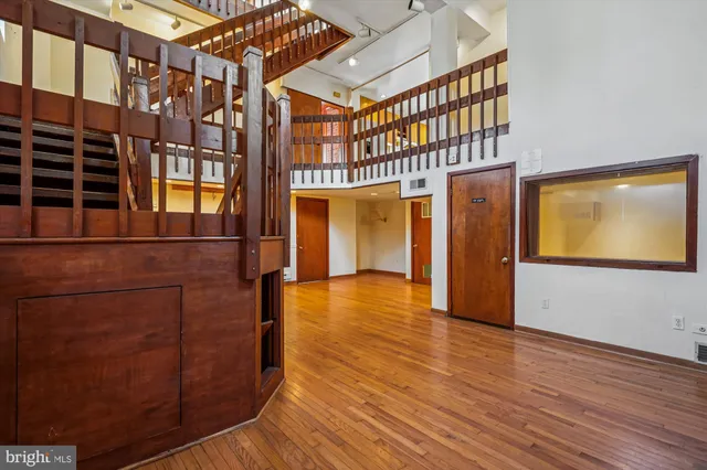 a view of an entryway with wooden floor