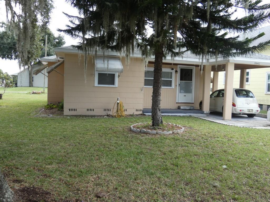 a backyard of a house with lots of green space