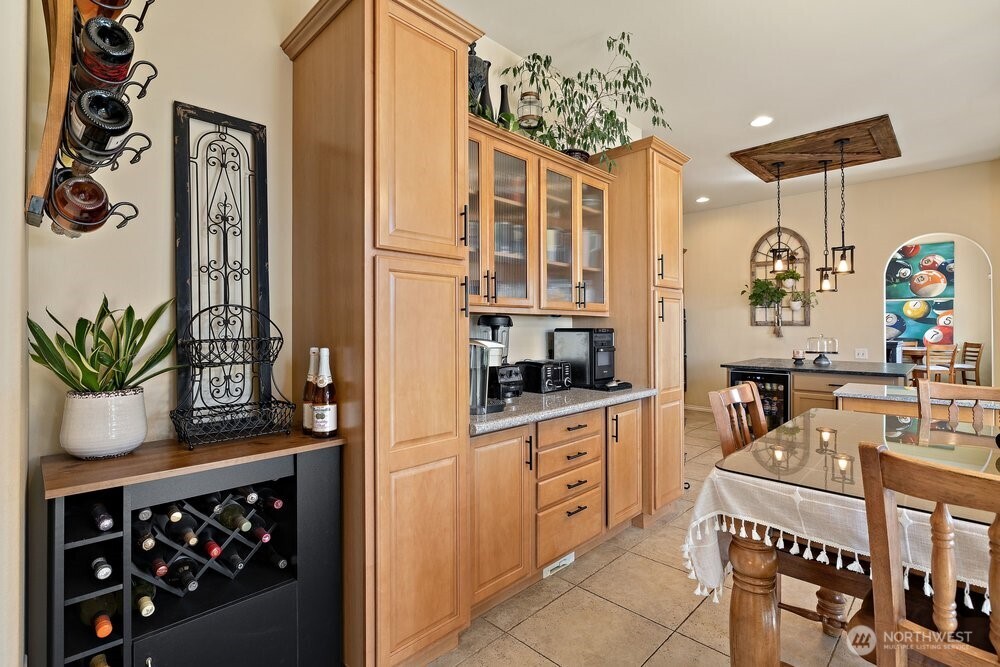 500 St Hilaire Road Yakima, WA 98901 - Photo 7 of 31 a kitchen with stainless steel appliances kitchen island granite countertop a refrigerator and a stove top oven